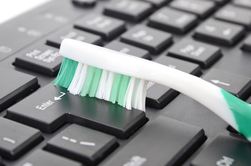 Best All-Natural Cleaning Tips #7:  Cclean up your keyboard with a toothbrush and vinegar.